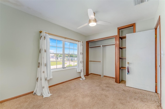 unfurnished bedroom featuring visible vents, baseboards, and carpet flooring