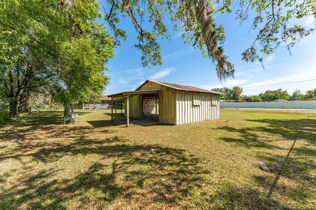 exterior space with a lawn and fence