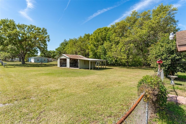 view of yard featuring an outbuilding and a pole building