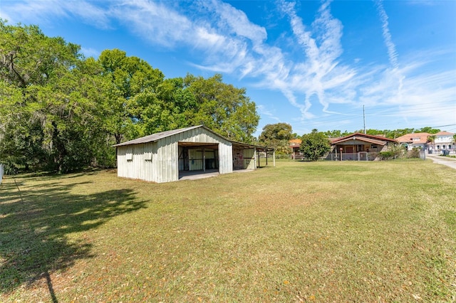 view of yard with an outbuilding and a pole building