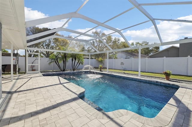 view of pool featuring a lanai, a fenced in pool, a fenced backyard, and a patio area