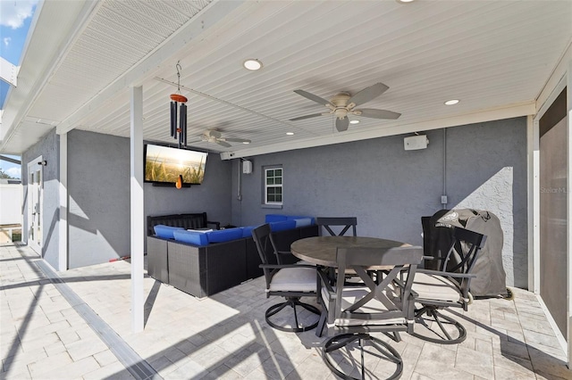 view of patio / terrace with area for grilling, ceiling fan, and outdoor dining space