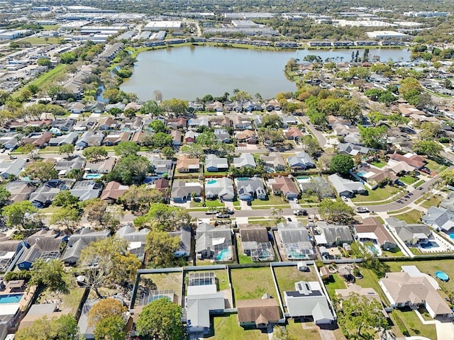 birds eye view of property with a residential view and a water view