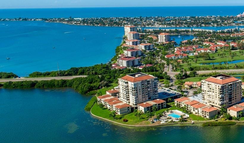 drone / aerial view featuring a water view and a city view