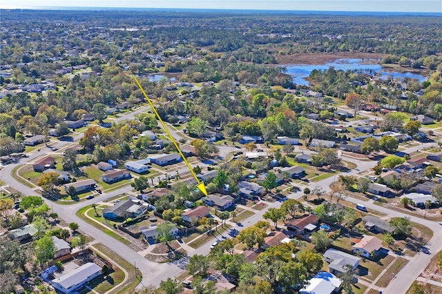 bird's eye view featuring a residential view and a water view