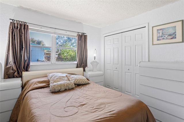 bedroom featuring a closet and a textured ceiling