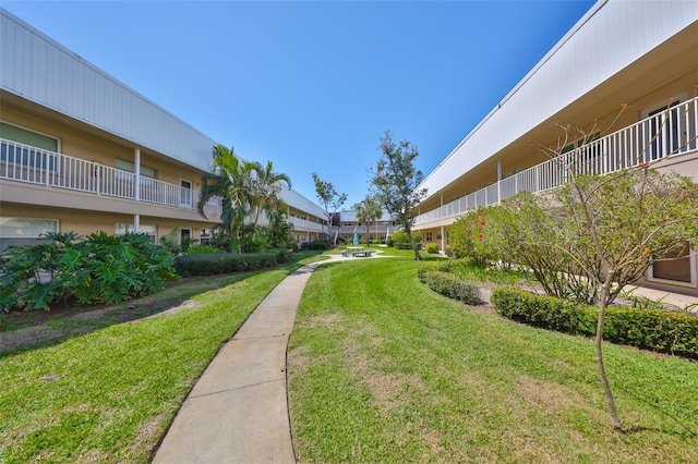 view of home's community featuring a lawn