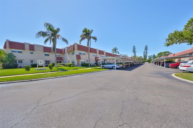 view of road featuring curbs, sidewalks, and a residential view