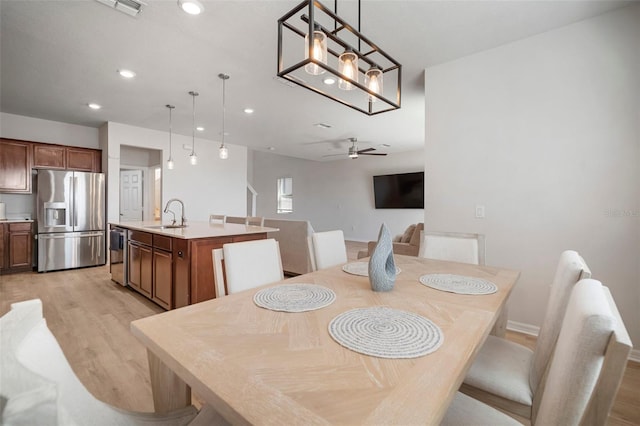 dining room with recessed lighting, baseboards, light wood finished floors, and ceiling fan