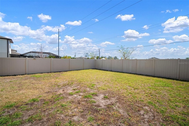 view of yard with a fenced backyard