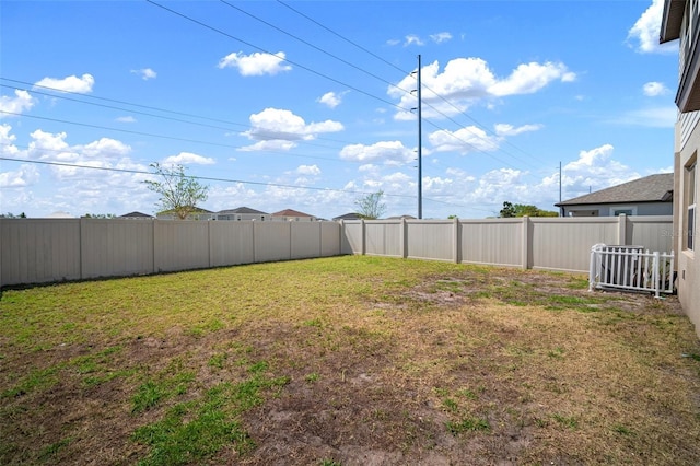 view of yard featuring a fenced backyard