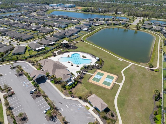 bird's eye view with a residential view and a water view