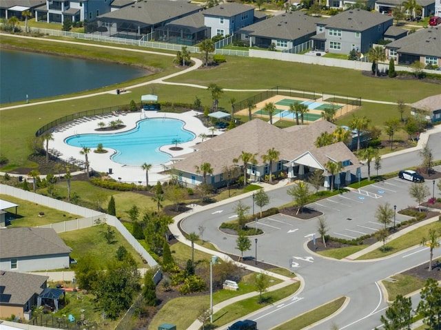 birds eye view of property with a residential view and a water view