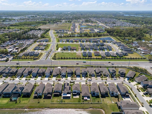 aerial view featuring a residential view and a water view