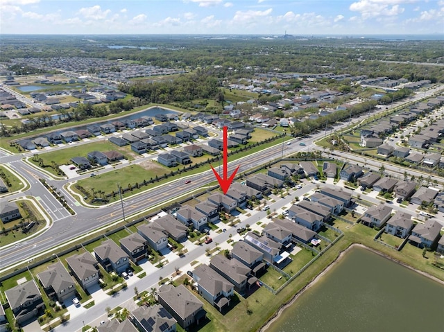 aerial view with a residential view and a water view