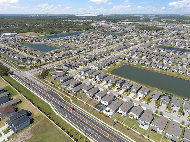 bird's eye view featuring a residential view and a water view