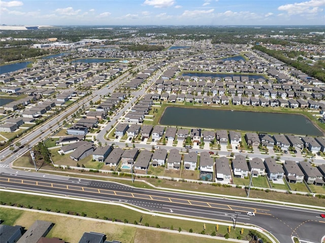 birds eye view of property featuring a residential view and a water view