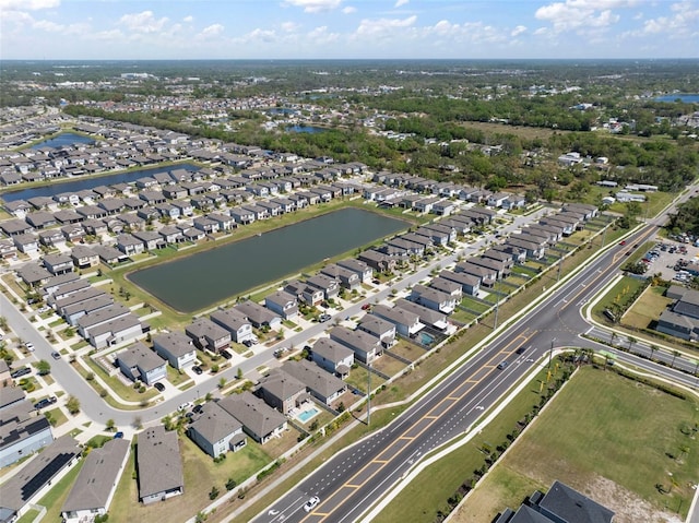 bird's eye view with a residential view and a water view