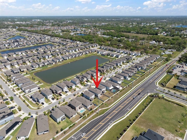 birds eye view of property with a residential view and a water view