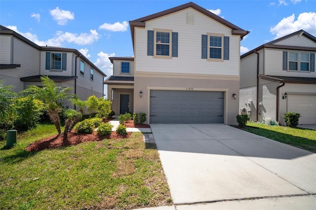 view of front facade with a garage, a front yard, and driveway