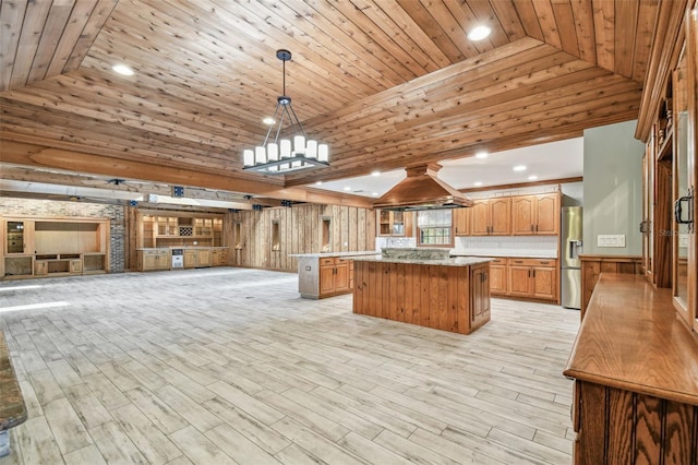 kitchen with a kitchen island, wood ceiling, stainless steel fridge with ice dispenser, and island range hood