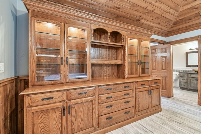 interior details with wooden ceiling, wood finished floors, and wainscoting
