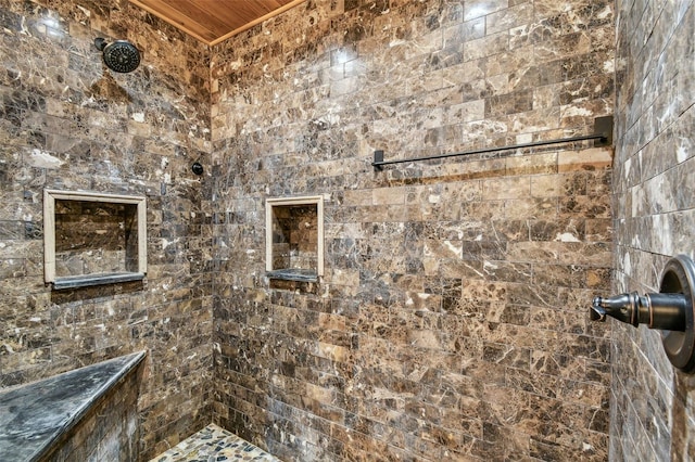 bathroom with tiled shower