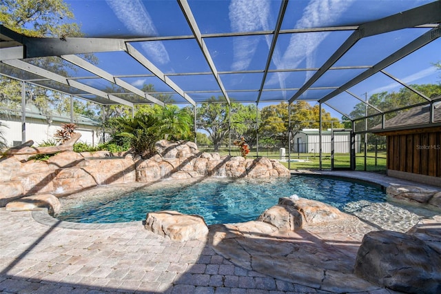 view of swimming pool featuring a lanai, a fenced in pool, a patio, and fence