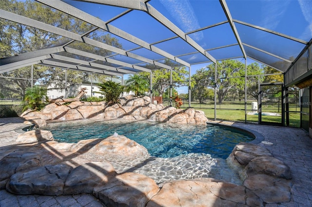 pool with a lanai and a patio