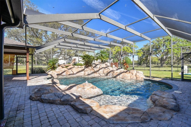 pool with glass enclosure and a patio