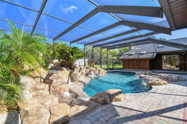 pool with a lanai and a patio