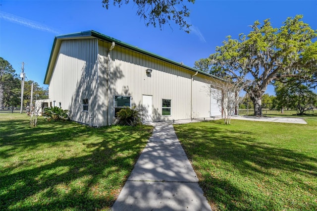 exterior space with a yard and a garage