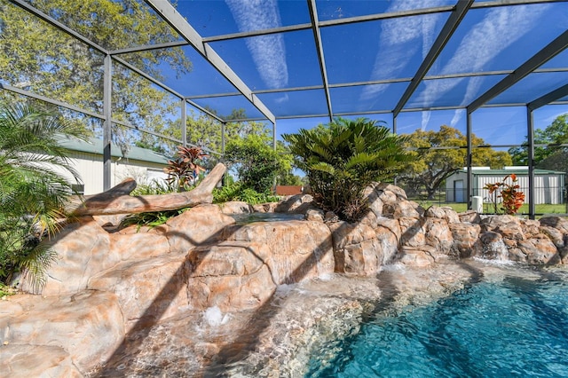 view of pool with a lanai