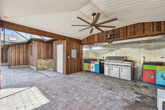 interior space with grilling area and a ceiling fan