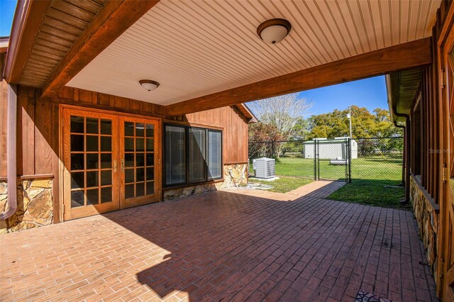 view of patio / terrace featuring a gate, french doors, and fence