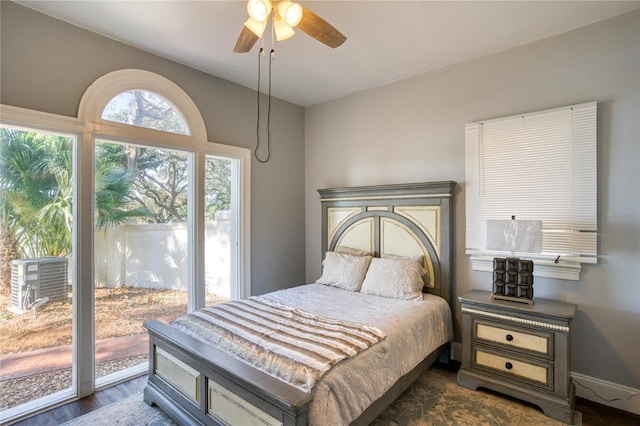 bedroom featuring dark wood finished floors, baseboards, access to exterior, and a ceiling fan