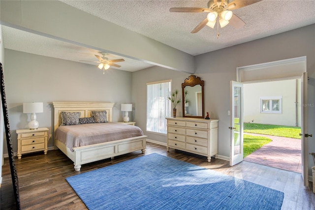 bedroom with access to exterior, a textured ceiling, wood finished floors, baseboards, and ceiling fan