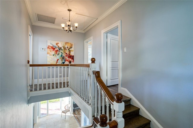 staircase featuring visible vents, baseboards, an inviting chandelier, and ornamental molding