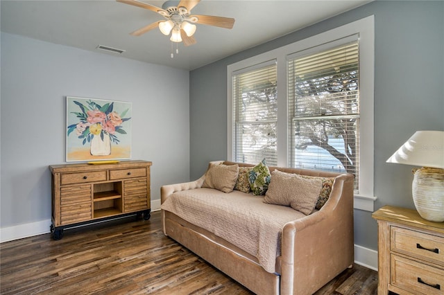 bedroom featuring visible vents, ceiling fan, dark wood-type flooring, and baseboards