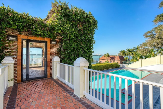 exterior space with a fenced in pool and fence