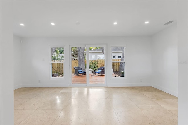 unfurnished room featuring visible vents, baseboards, and recessed lighting