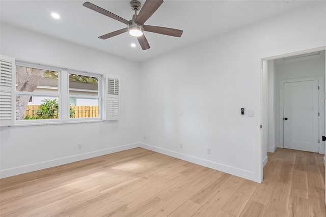 spare room with a ceiling fan, light wood-style flooring, baseboards, and recessed lighting