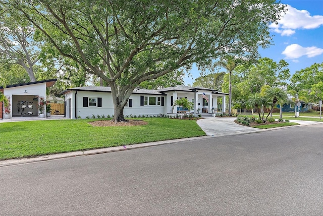 view of front of property with a front lawn and a garage