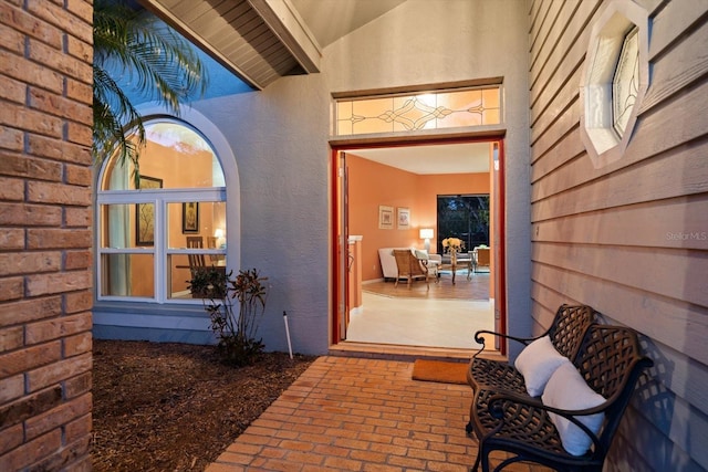 property entrance featuring a patio area and stucco siding