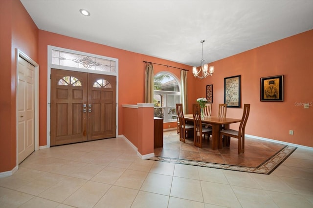 dining room featuring light tile patterned floors, recessed lighting, baseboards, and a chandelier