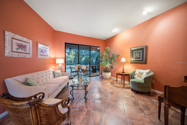 living area featuring baseboards