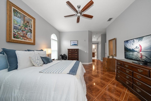 bedroom featuring visible vents, baseboards, dark tile patterned flooring, and ceiling fan