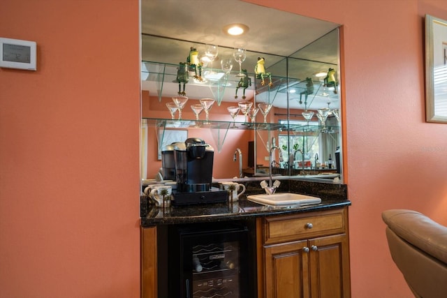 bar with wet bar, beverage cooler, and a sink