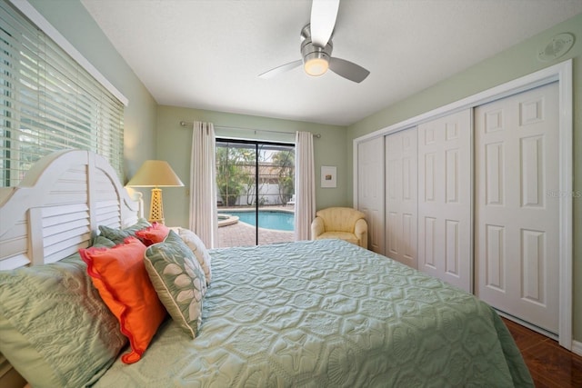 bedroom with access to outside, dark wood-style floors, a closet, and ceiling fan