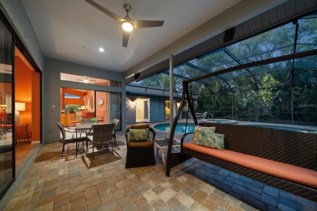 sunroom featuring a pool and ceiling fan